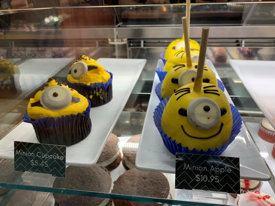 Minion-themed treats in a bakery display case at Universal Studios