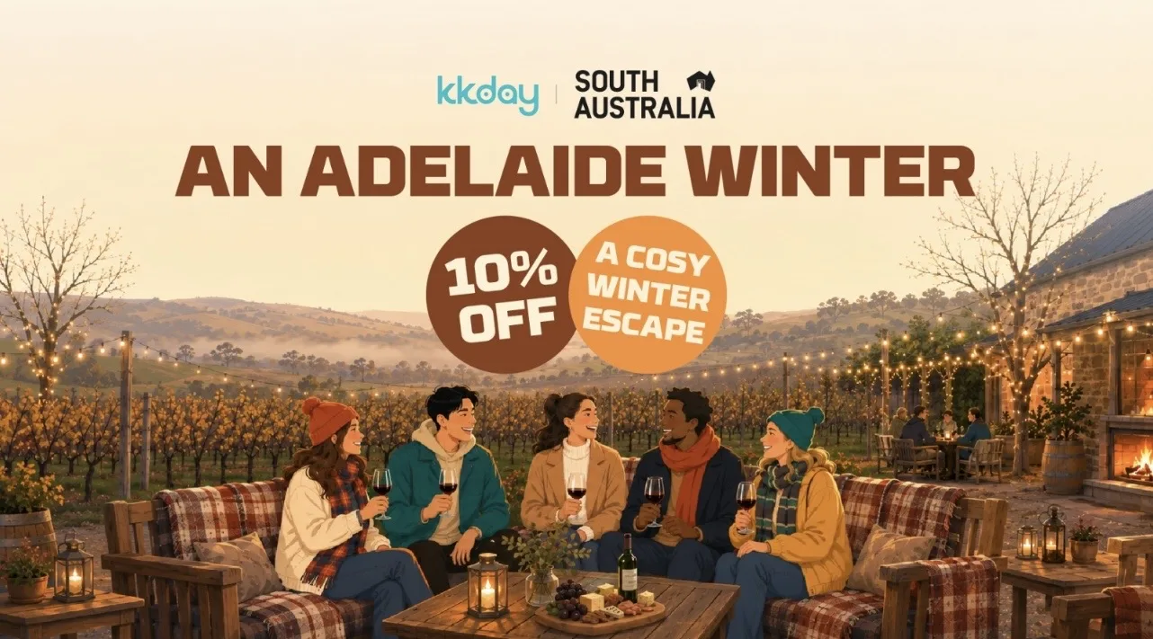 Five friends enjoying wine at an outdoor vineyard patio in Adelaide during a cozy winter evening.