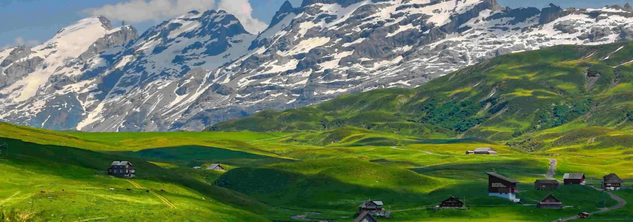 Swiss Alps green meadows mountain landscape Switzerland