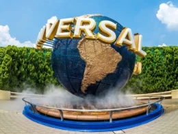 Universal Studios Japan globe entrance in Osaka with blue sky and trees in the background