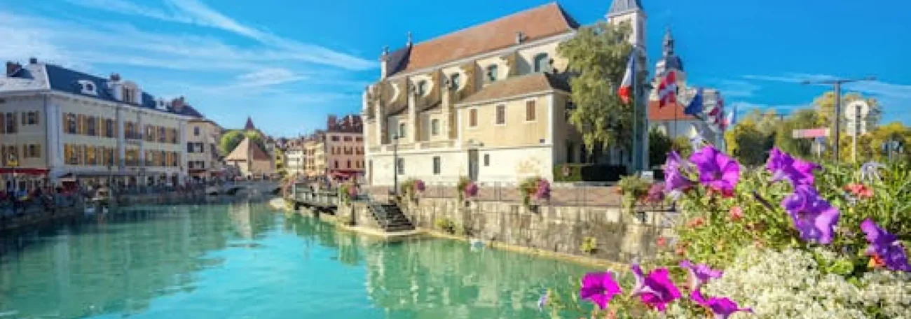 Annecy old town canal pastel buildings flowers Geneva day trip